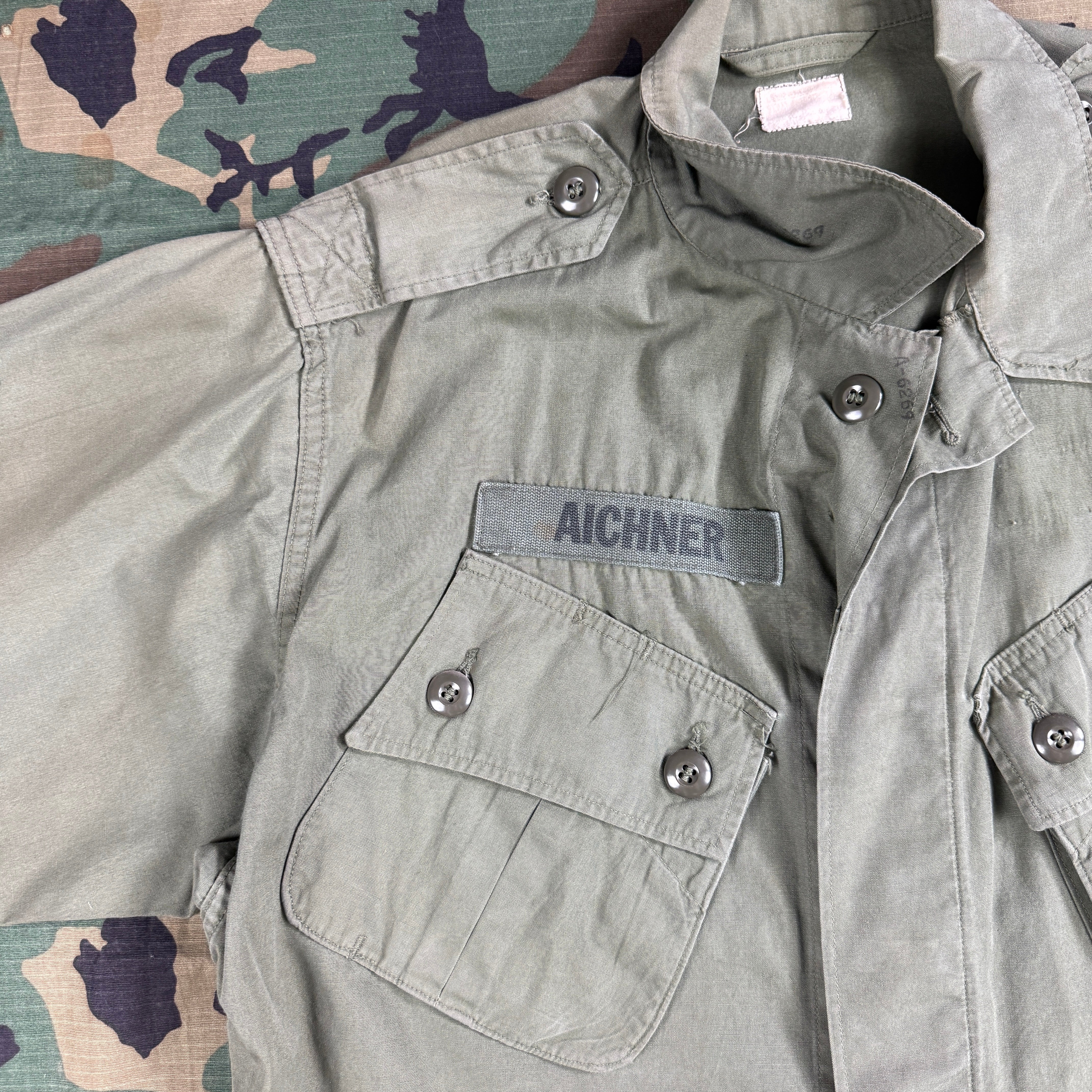 US Army 1964 Exposed Button 1st Pattern Jungle Jacket - Named to Green Beret