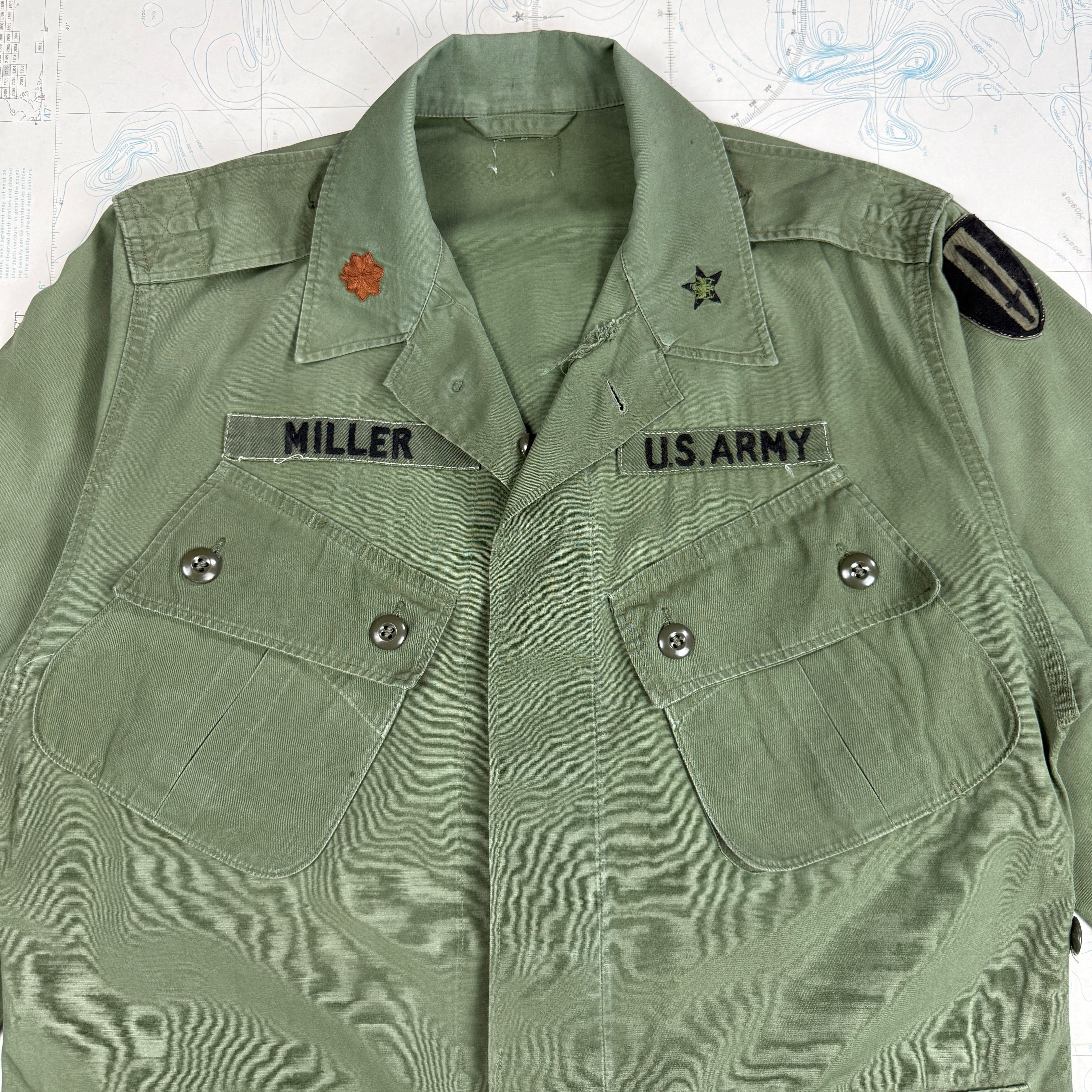 US Army 1964 Exposed Button 1st Pattern Jungle Jacket with Patches