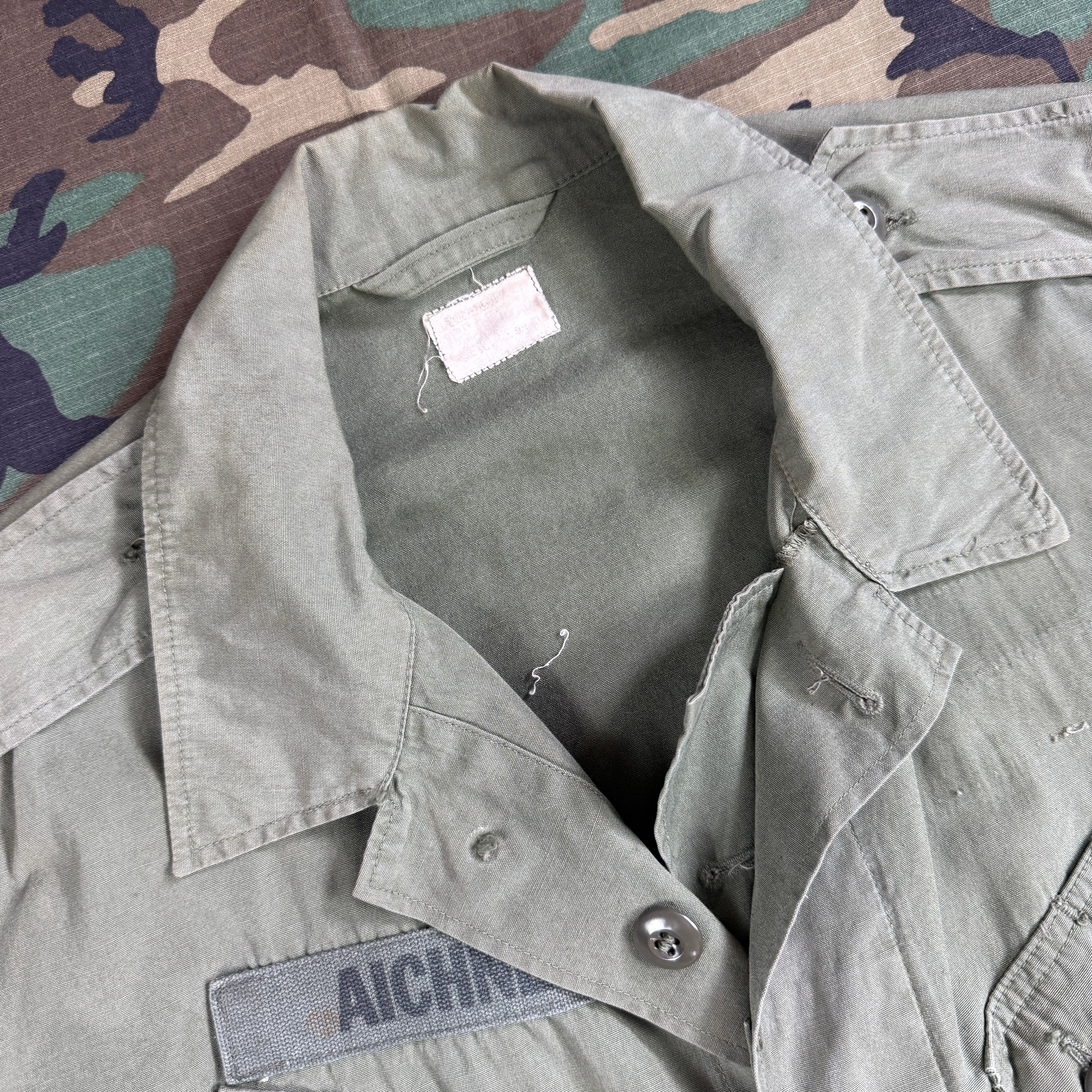 US Army 1964 Exposed Button 1st Pattern Jungle Jacket - Named to Green Beret